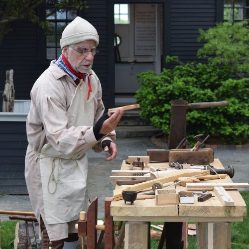 Mike Welch offers a demonstration of historical carpentry at The House of the Seven Gables