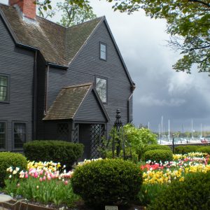 Exterior Image of The House of the Seven Gables with tulips in bloom