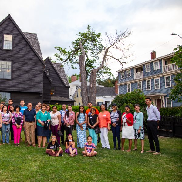 A group gathering at The House of the Seven Gables after a tour