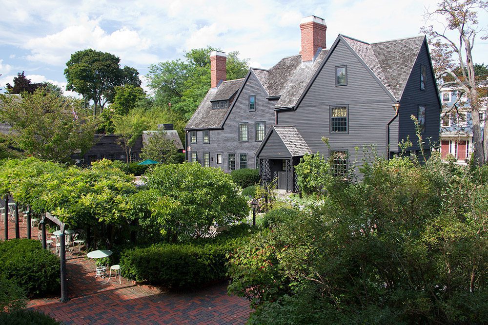 View of the House of Seven Gables from the Garden on a sunny day.|Mass Humanities Logo