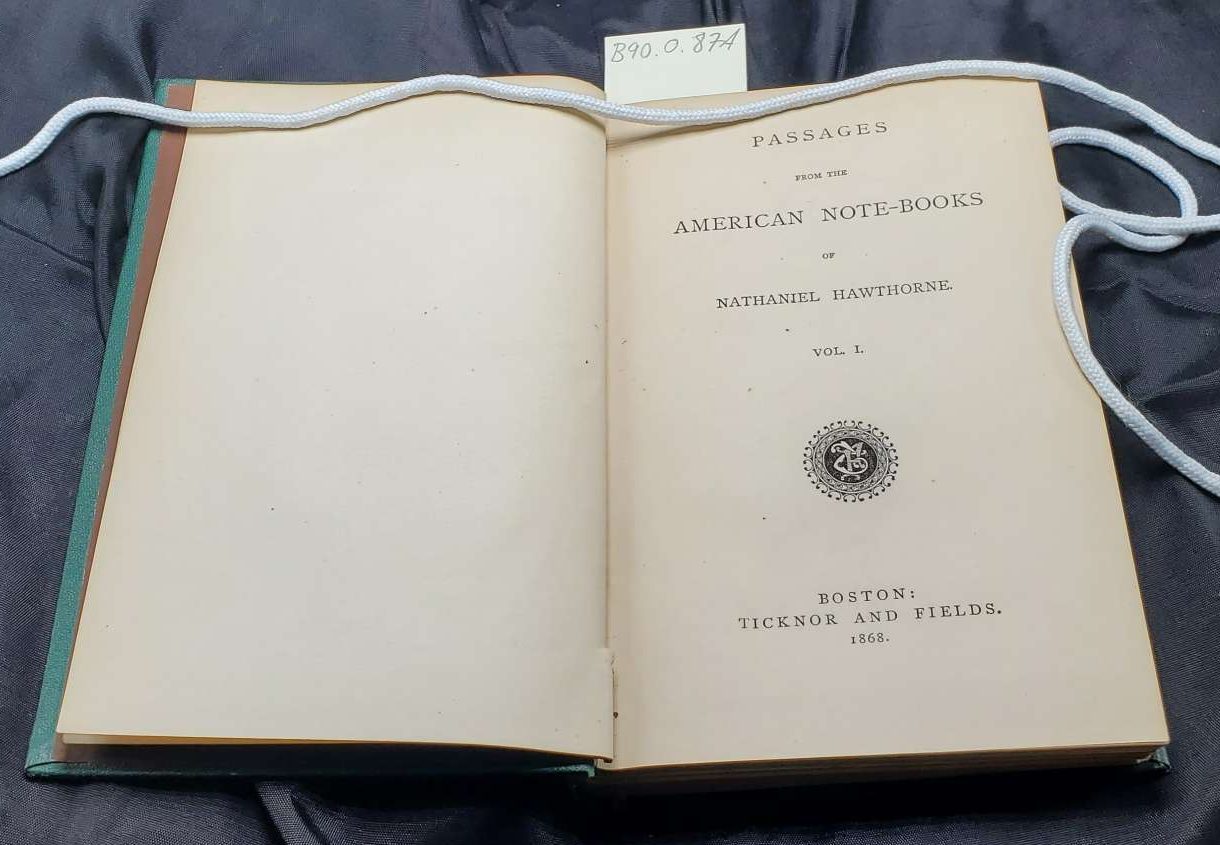 A green book cover.|A green book spine cover with blocked-in-gilt embellishments and text Nathaniel Hawthorne's Works Passages from American Note-Books Vol. 1.|Two book pages