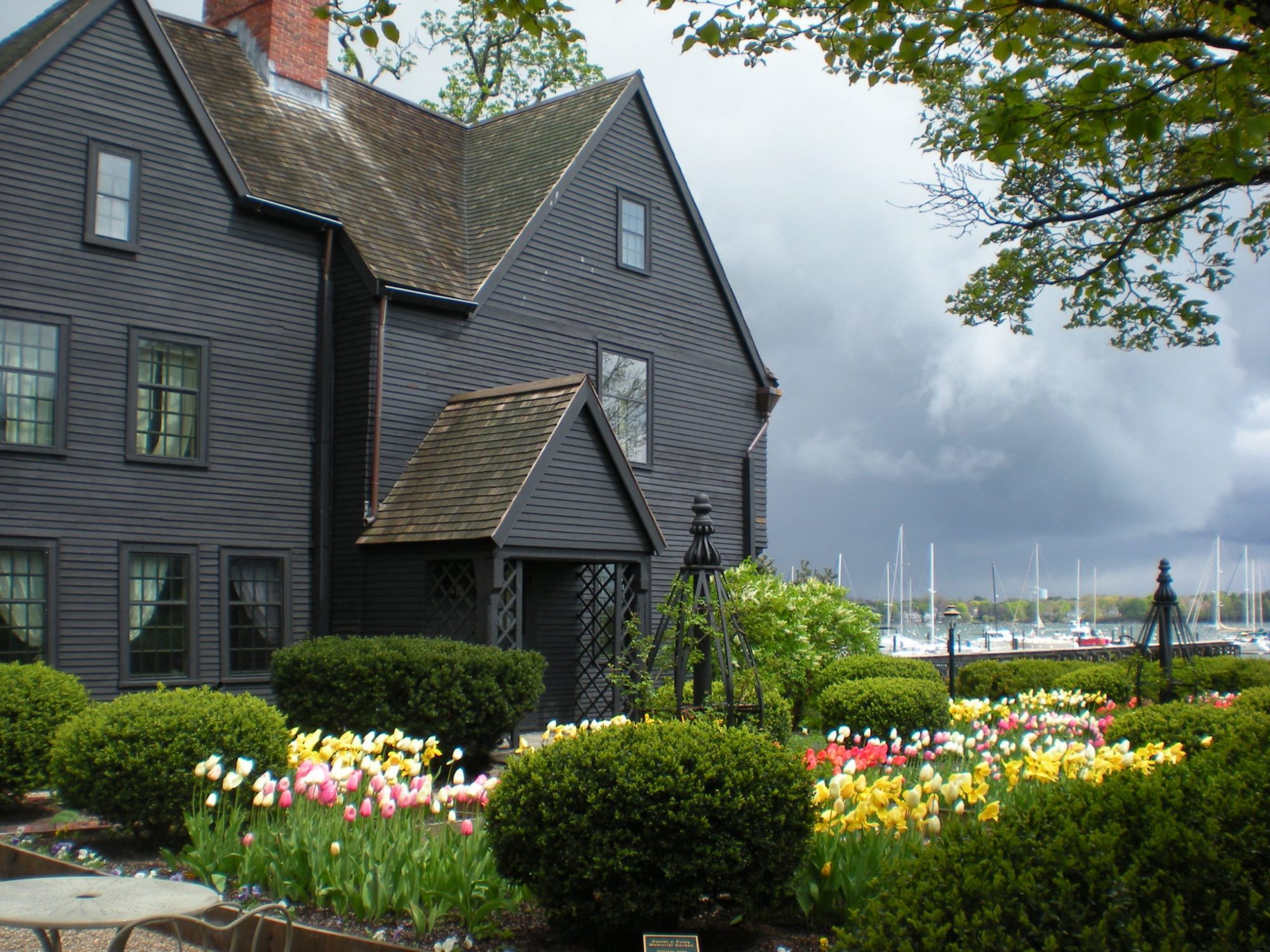 Exterior Image of The House of the Seven Gables with tulips in bloom