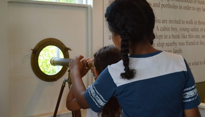 Two girls and a telescope
