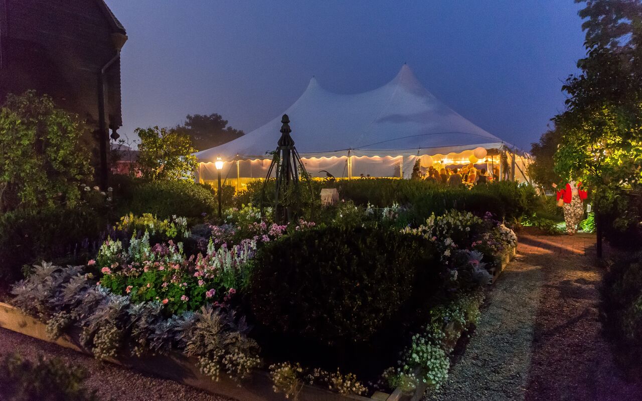 Tent on the seaside lawn at dusk - The House of the Seven Gables