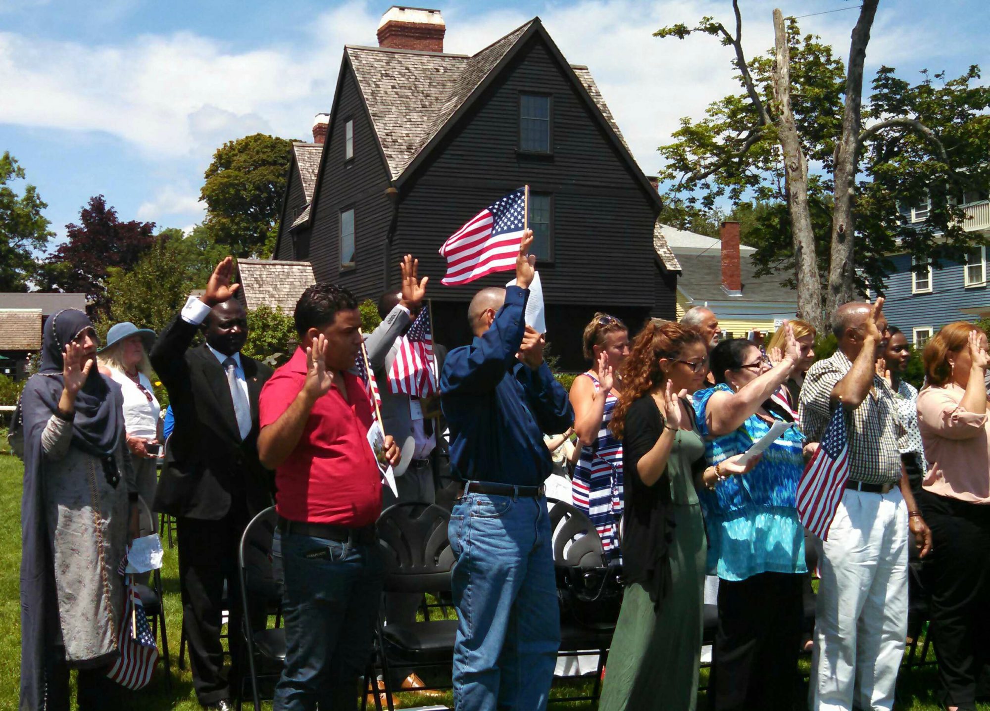 Picture of new American citizens being sworn in at The House of the Seven Gables