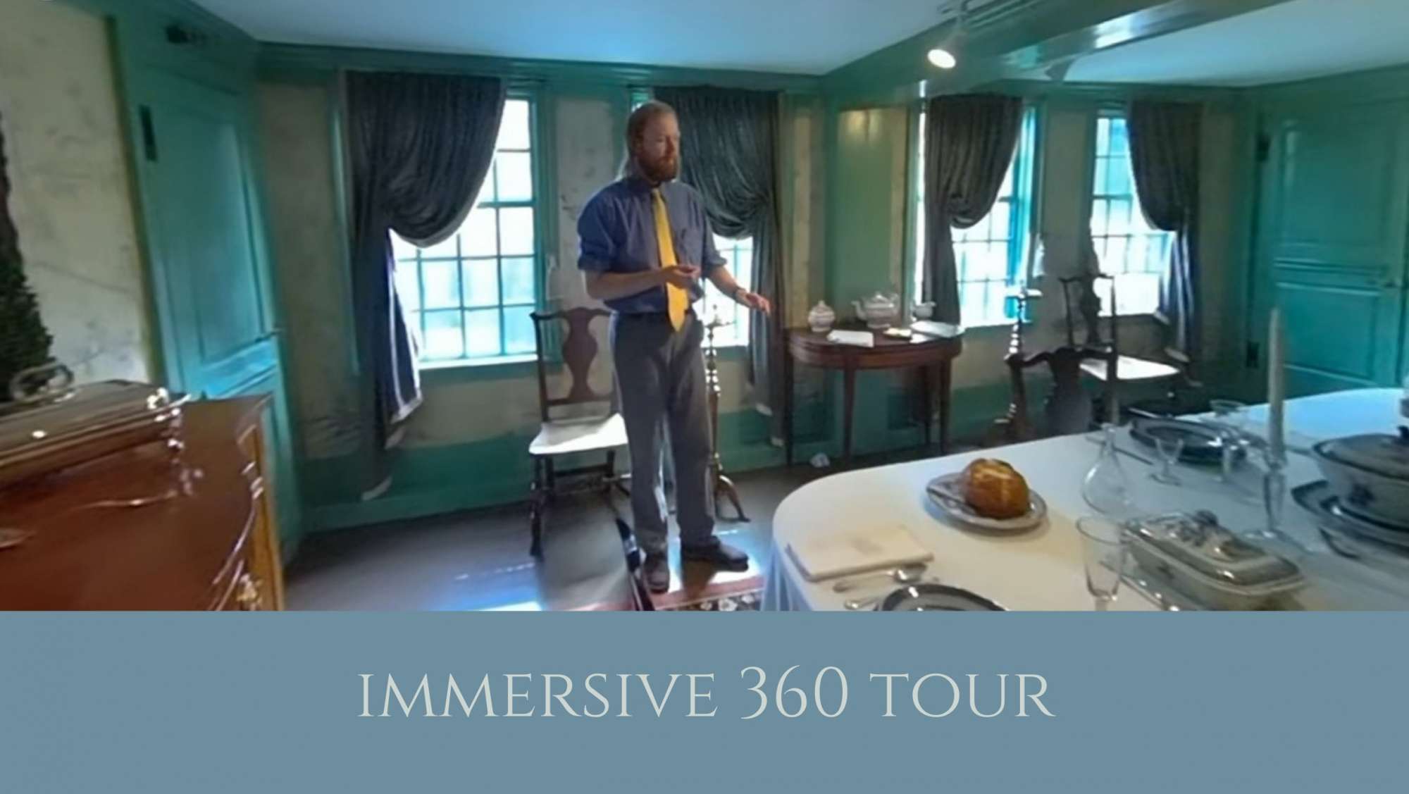 man in a dining room in a historic house