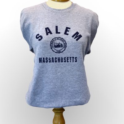 The front view of the gray House of the Seven Gables crewneck that features a small image of the House of the Seven Gables, encircled by "Salem, Massachusetts" in blue.