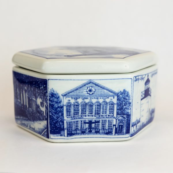 Side view of the delft hexagonal box that shows an image of the East India Marine Hall.