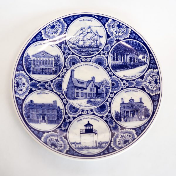 Front side of Delft plate that has seven images of historic Salem locations.