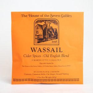 The front of the Wassail Cider Spices packet that has an image of the House of the Seven Gables across the front.
