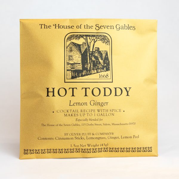 The front of the Hot Toddy Lemon Ginger Spice Packet. It features an image of the House of the Seven Gables across the front.